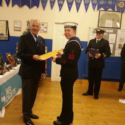 The Commodore presents to Sea Cadet 2016